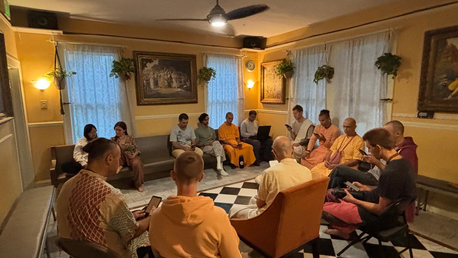 Devotees gathered for a Śrīmad-Bhāgavatam class at Krishna House